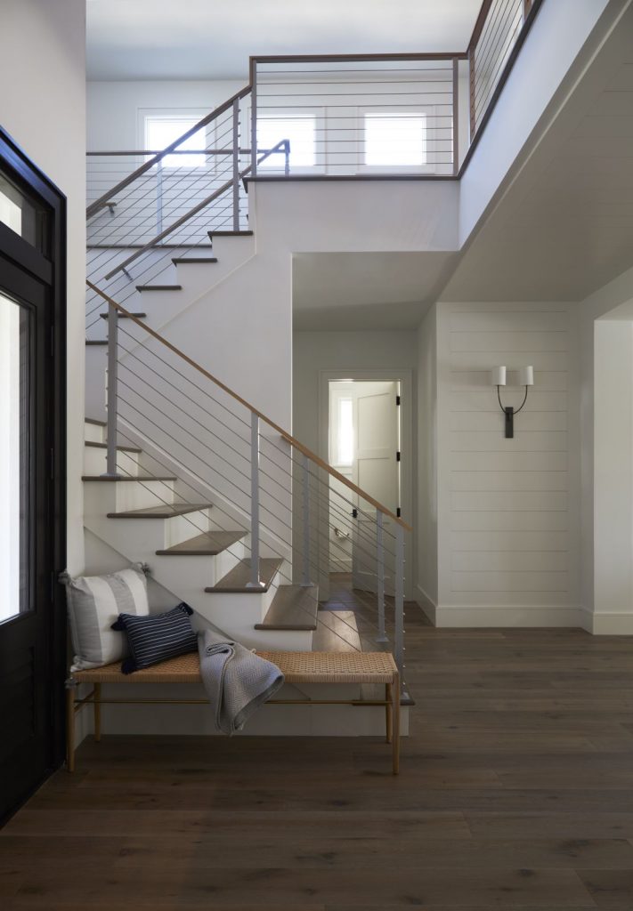 Stairway in foyer of custom home