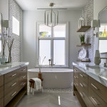 Primary bath with double vanity chandelier and soaking tub